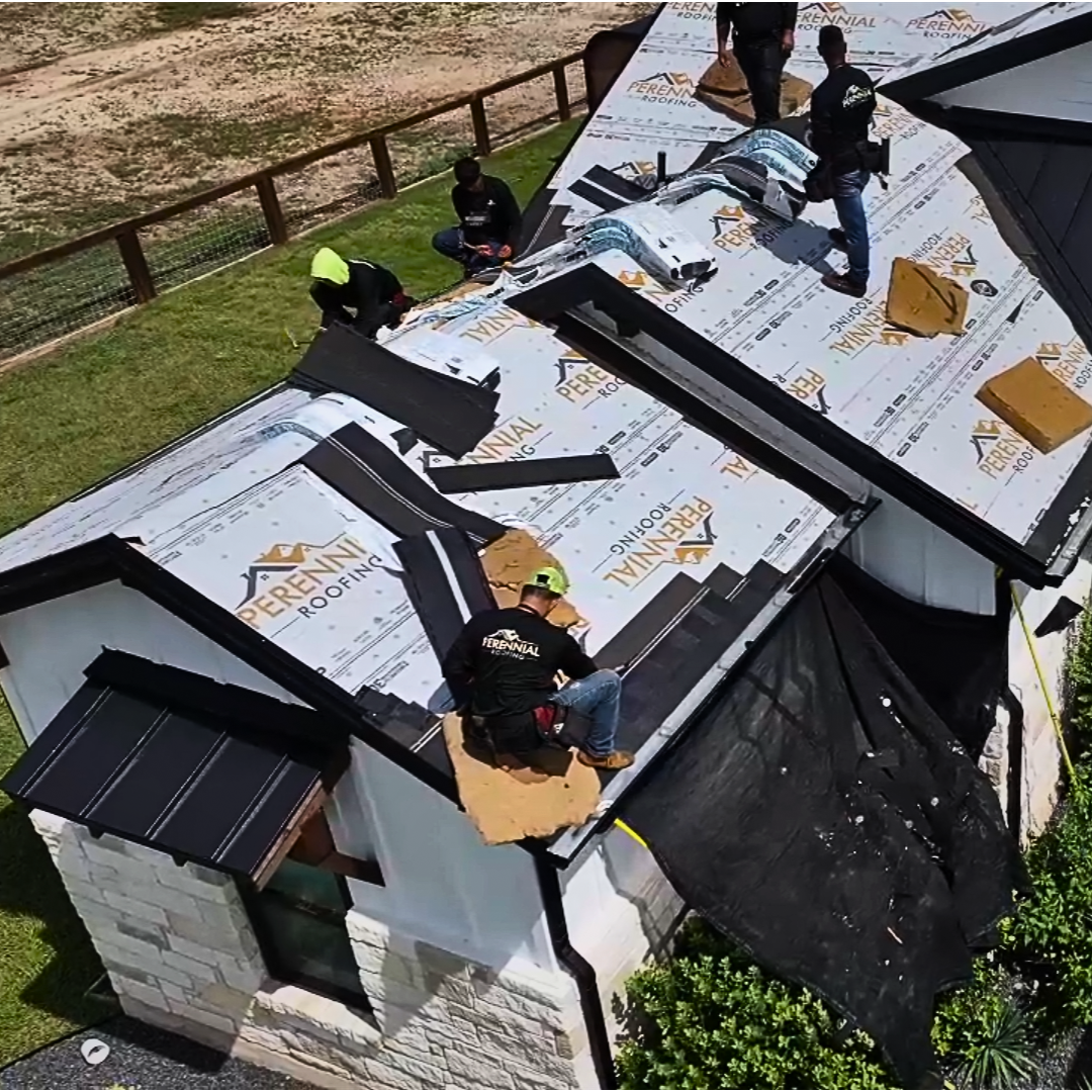 Perennial Roofing crew installing a new roof in Central Texas